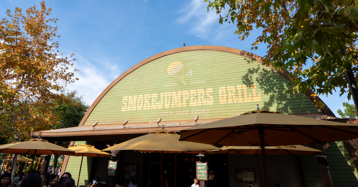 011824_California-Adventure_Grizzly-Peak_Smoke-Jumpers-Grill_Exterior01_Danny-Shuster (FI) Smokejumpers Grill entrance sign on sunny day