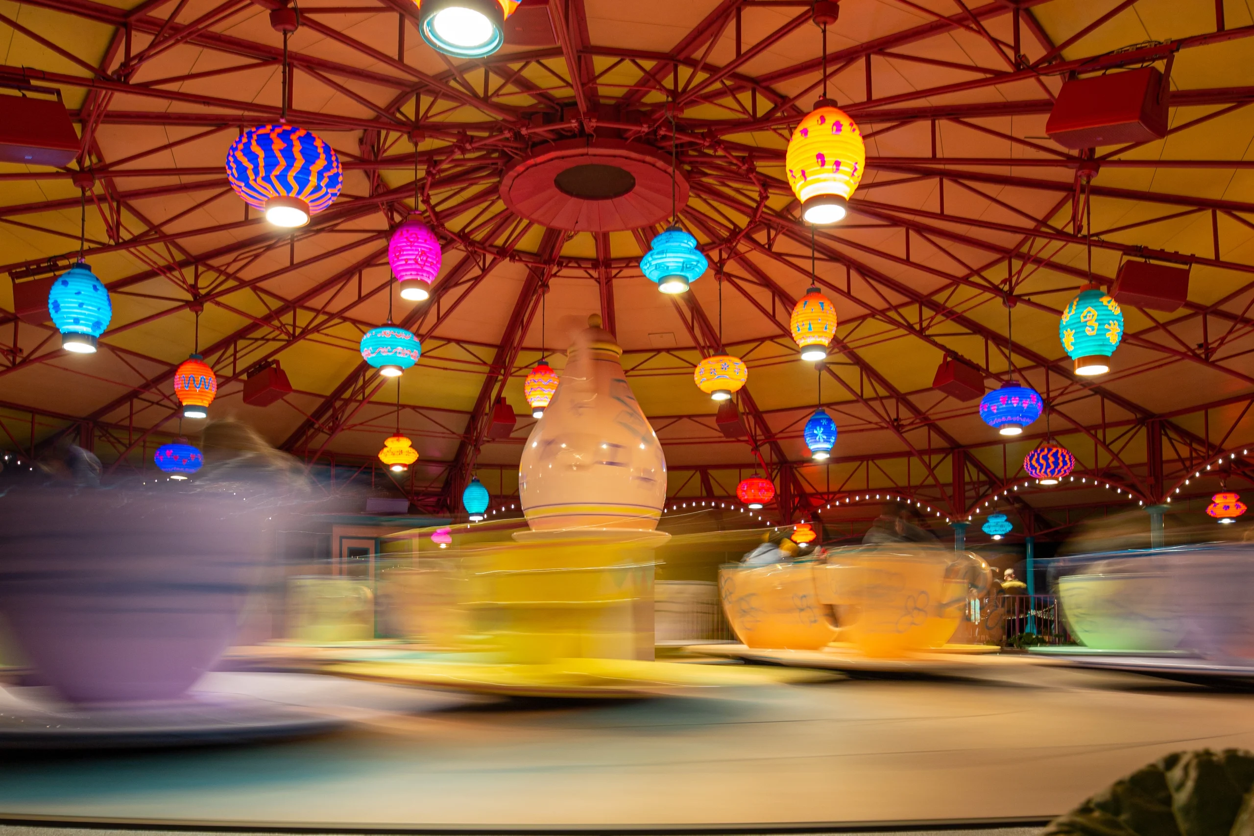 Mad Tea Party, spinning teacups at night