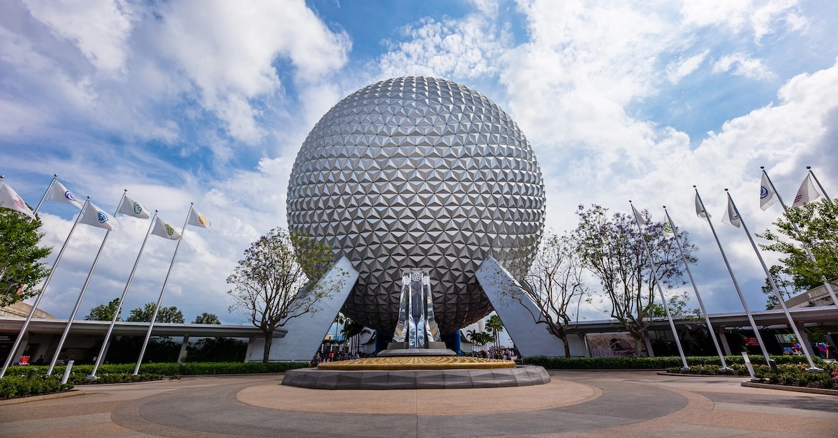 04182021_EPCOT_Entrance_SSE-Pylons-Flags_Ernie-Carr (FI) EPCOT entrance, Spaceship Earth during the day
