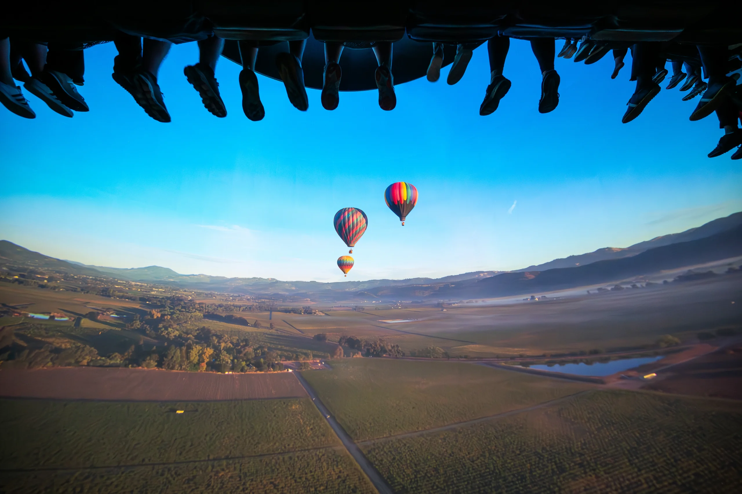 Soarin' Around the World hot air balloon scene, dangling feet above
