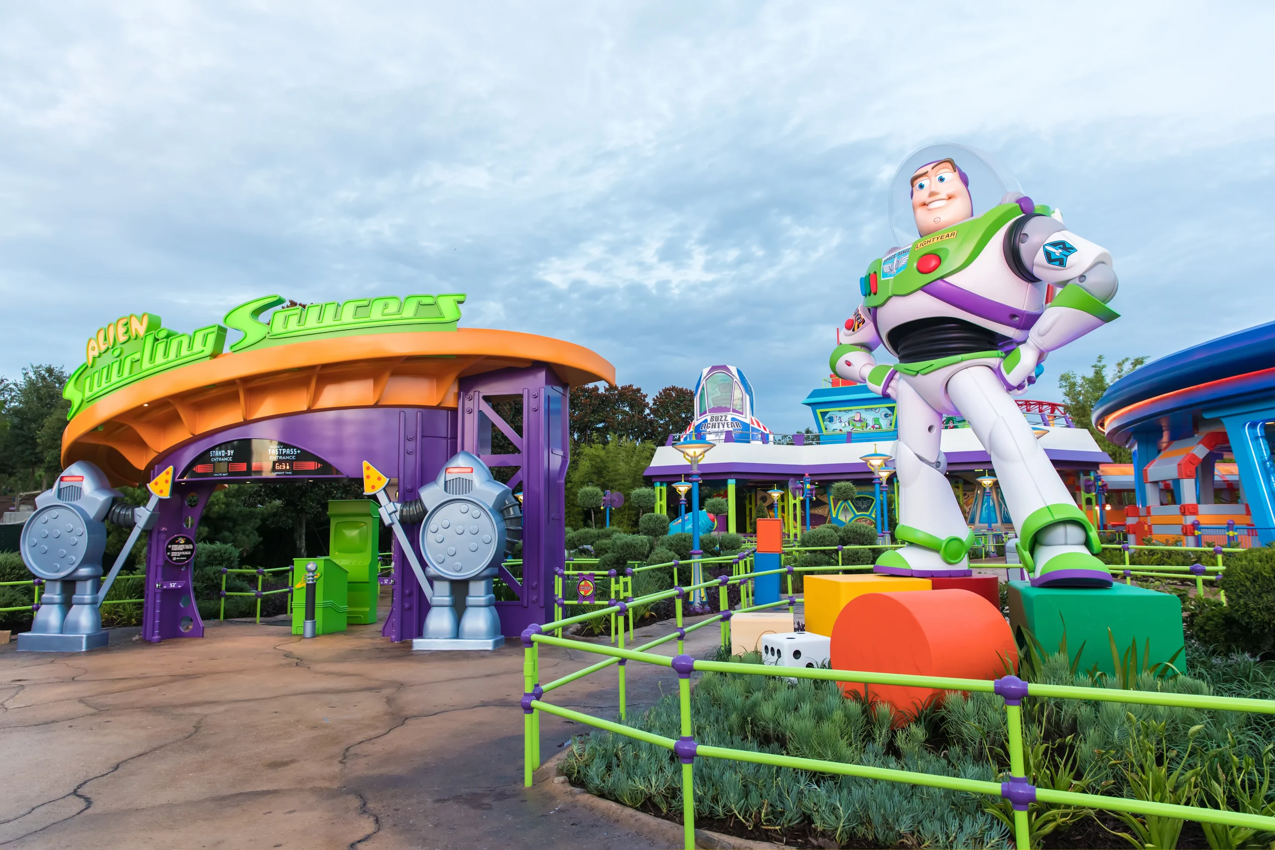 Alien Swirling Saucers entrance next to Buzz Lightyear statue